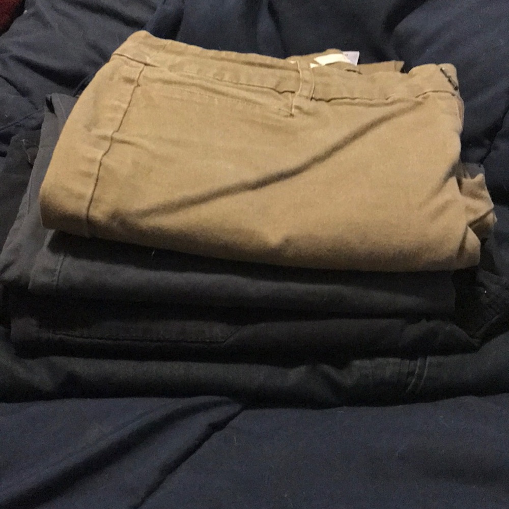 Four pairs of Dockers slacks; 3 blue, one tan